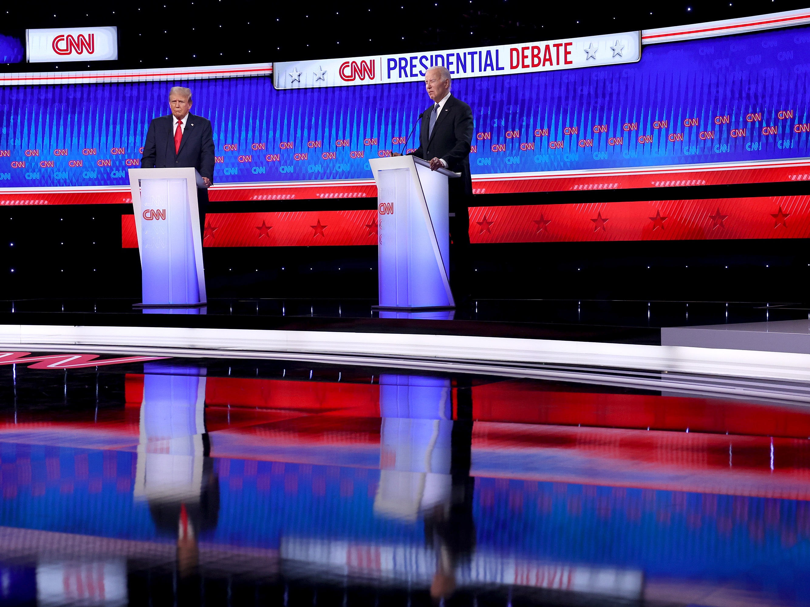 caption: U.S. President Joe Biden (R) and Republican presidential candidate, former U.S. President Donald Trump participate in the CNN Presidential Debate at the CNN Studios on June 27, 2024 in Atlanta, Georgia. 