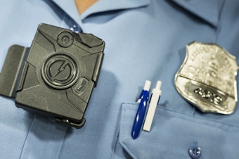 caption: A body camera from Taser is seen during a press conference on Sept. 24, 2014 in Washington, DC.