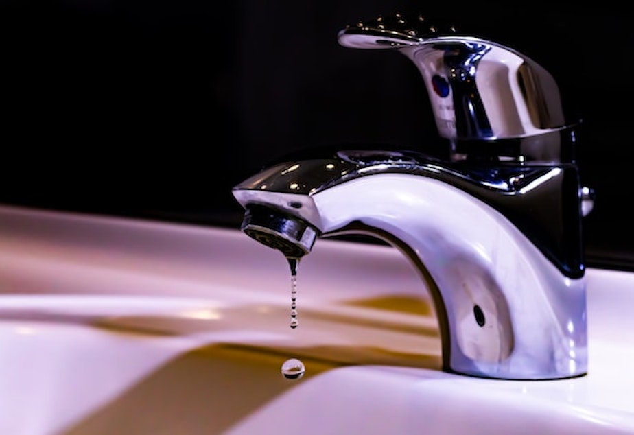 File photo of a sink faucet dripping water