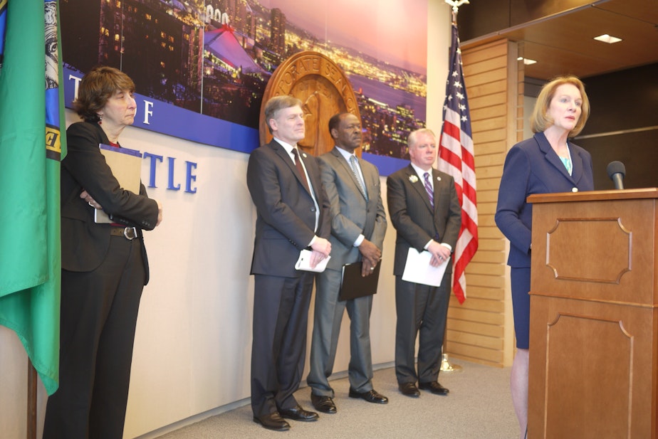 caption: U.S. Attorney Jenny Durkan speaks at a press conference about Seattle Police reforms.