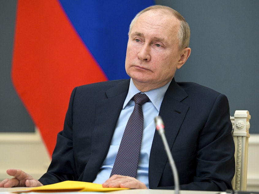 caption: Russian President Vladimir Putin is shown at a meeting on Wednesday. The U.S. is imposing new sanctions against a group of Russian entities and personnel.