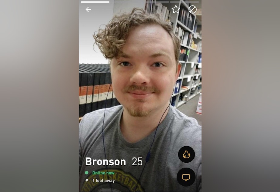 caption: Bronson Dowd was looking for love on Grindr, and instead he found an attack ad 