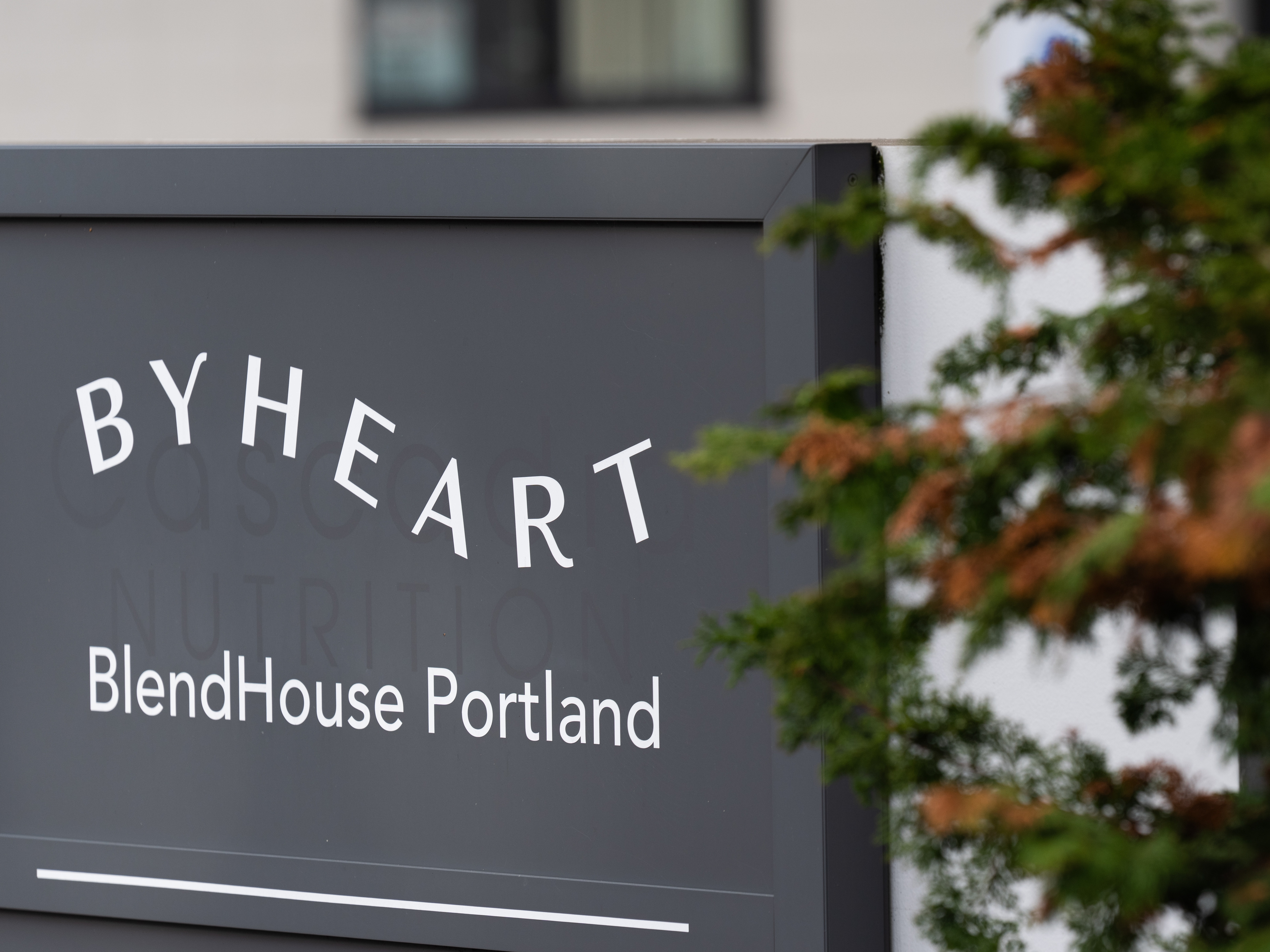 caption: FILE - A sign for ByHeart, a manufacturer of organic baby formula, is displayed outside a building that houses a plant for the company on Tuesday, Nov. 11, 2025, in Portland, Ore.