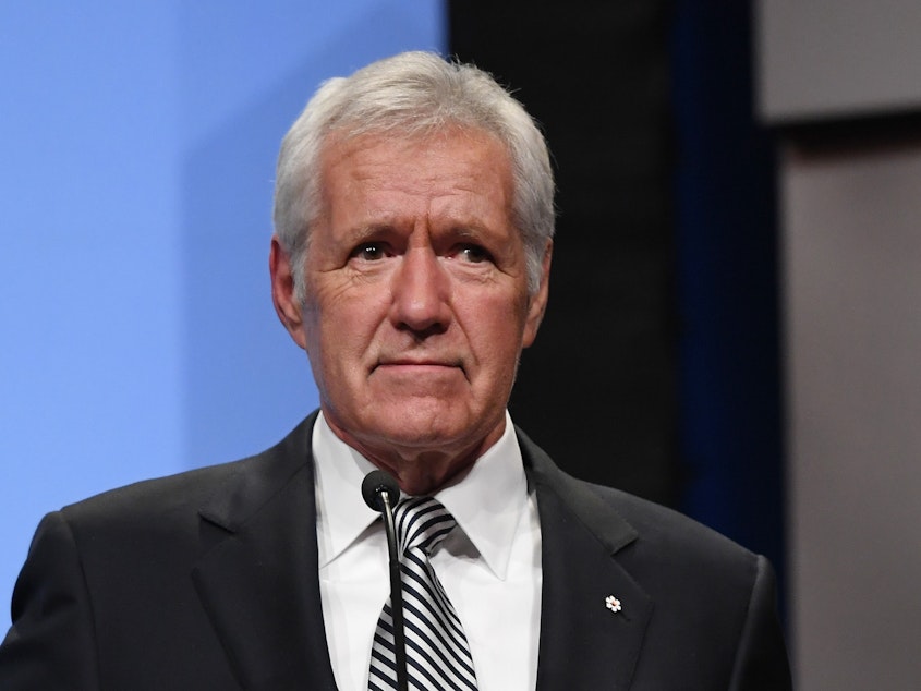 caption: <em>Jeopardy!</em> host Alex Trebek speaks as he is inducted into the National Association of Broadcasters' Broadcasting Hall of Fame in Las Vegas in April 2018. On Wednesday, he revealed that he was diagnosed with pancreatic cancer.