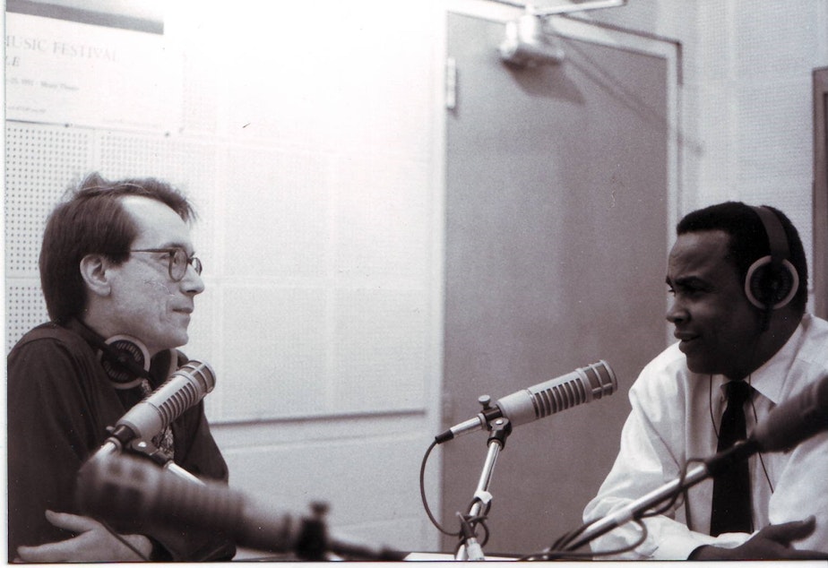 caption: Ross Reynolds in conversation with former Seattle Mayor Norm Rice.