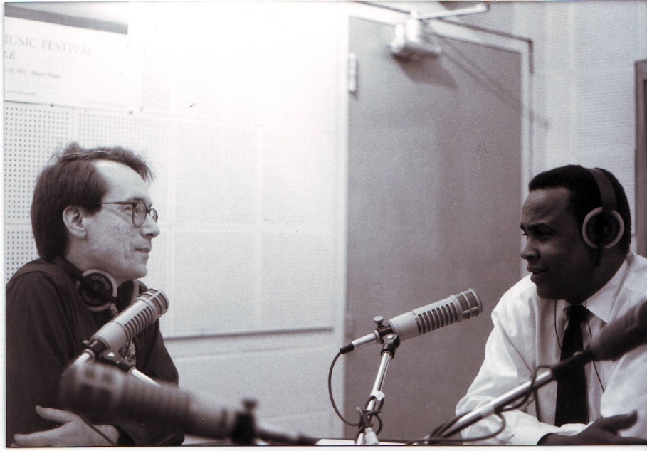 caption: Ross Reynolds in conversation with former Seattle Mayor Norm Rice.