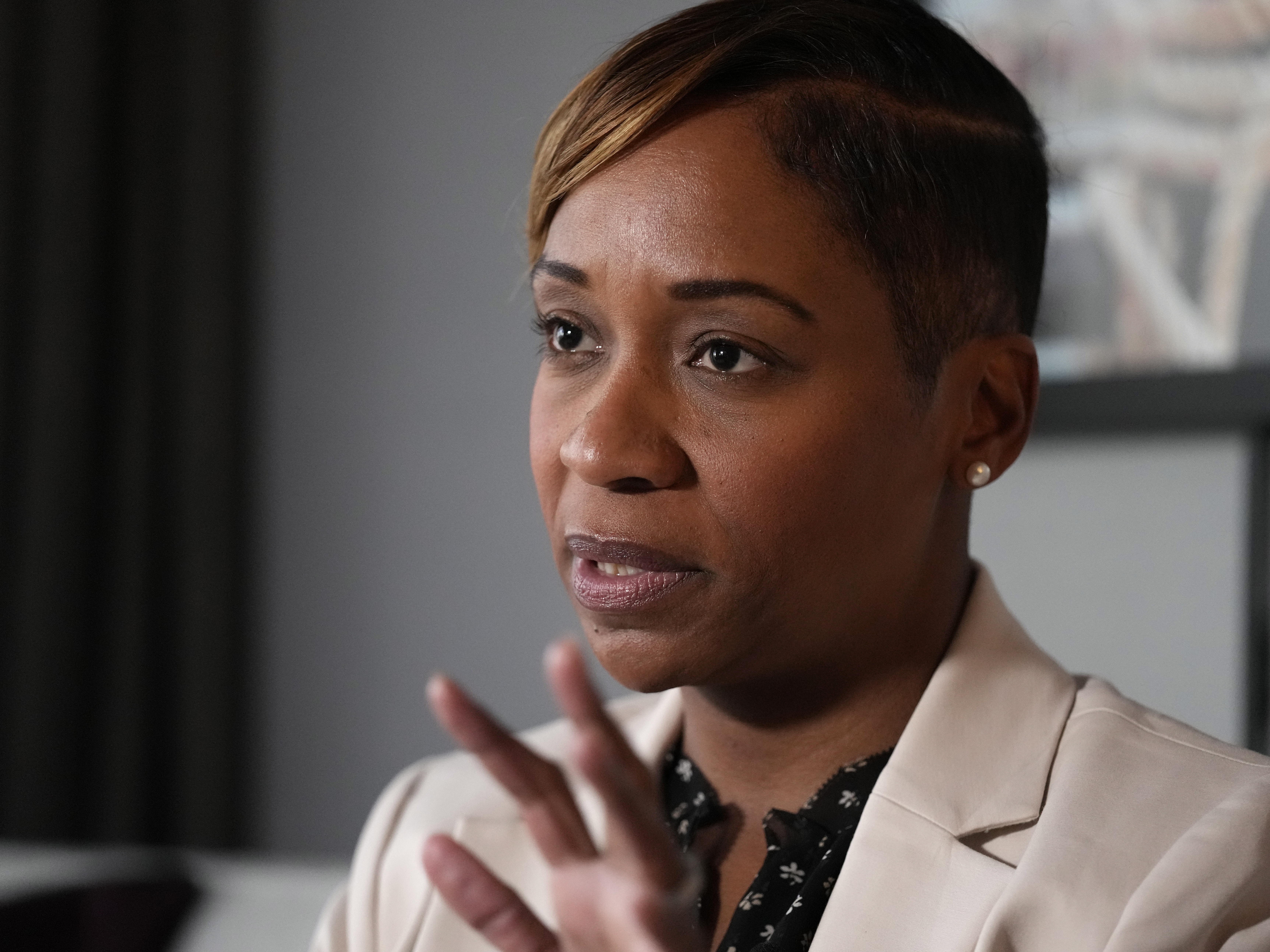 caption: The office of Massachusetts Attorney General Andrea Joy Campbell, pictured here, sued a crypto scam company known as SpireBit and seized its assets. The proceeds have now been handed back to victims of the scheme.