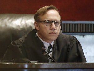 caption: Judge Thad Balkman holds a hearing Tuesday on his final judgment in the opioid lawsuit against Johnson & Johnson by the state of Oklahoma.
