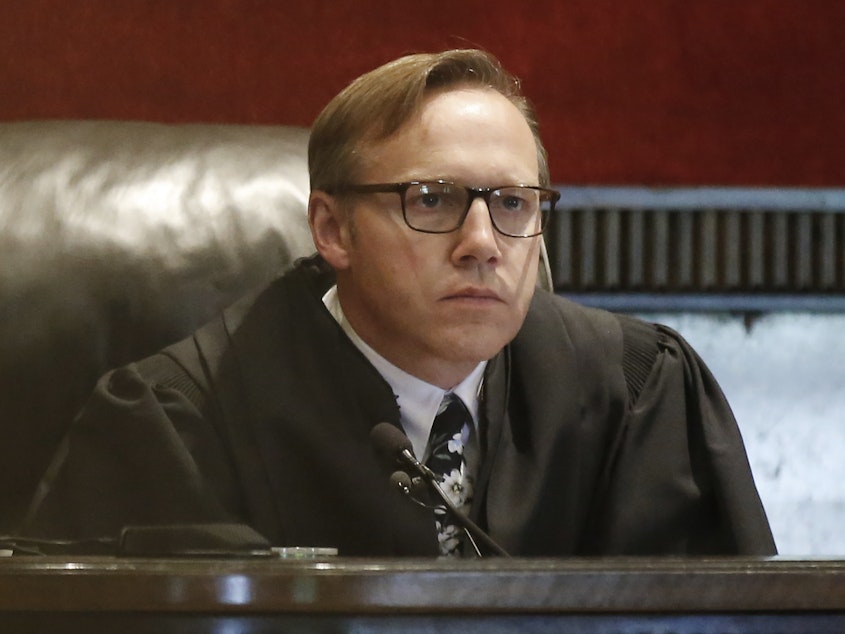 caption: Judge Thad Balkman holds a hearing Tuesday on his final judgment in the opioid lawsuit against Johnson & Johnson by the state of Oklahoma.