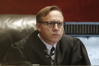 caption: Judge Thad Balkman holds a hearing Tuesday on his final judgment in the opioid lawsuit against Johnson & Johnson by the state of Oklahoma.
