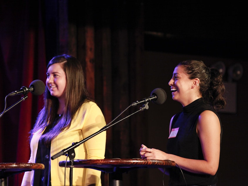 caption: Contestants Abby Grant and Laura Hernandez appear on <em>Ask Me Another</em> at the Bell House in Brooklyn, New York.