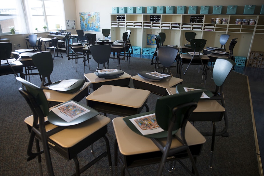 caption: An empty classroom is shown on the first day of school at Mount View Elementary school on Thursday, Sept. 2, 2021, in Seattle.