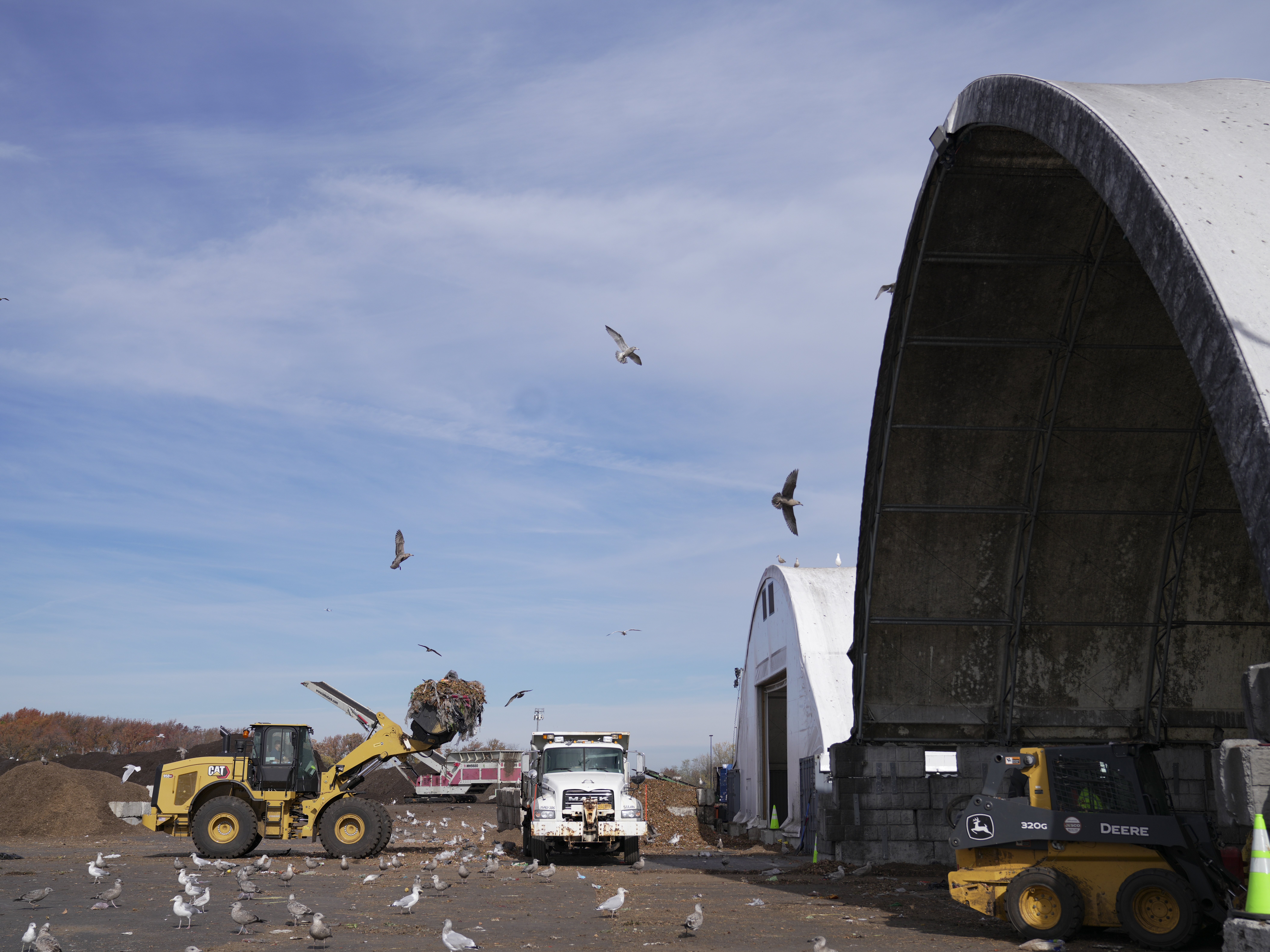 caption: A compost facility in Staten Island, New York aims to repurpose the city's food scraps and yard waste into fertilizer.