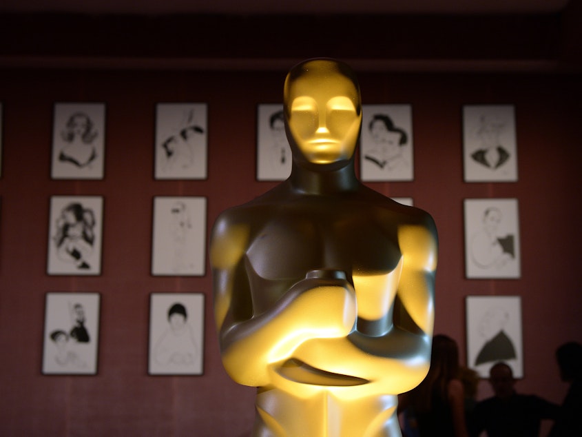 caption: A reproduction of an Oscar statuette stands tall at a 2016 media event in Hollywood, Calif.