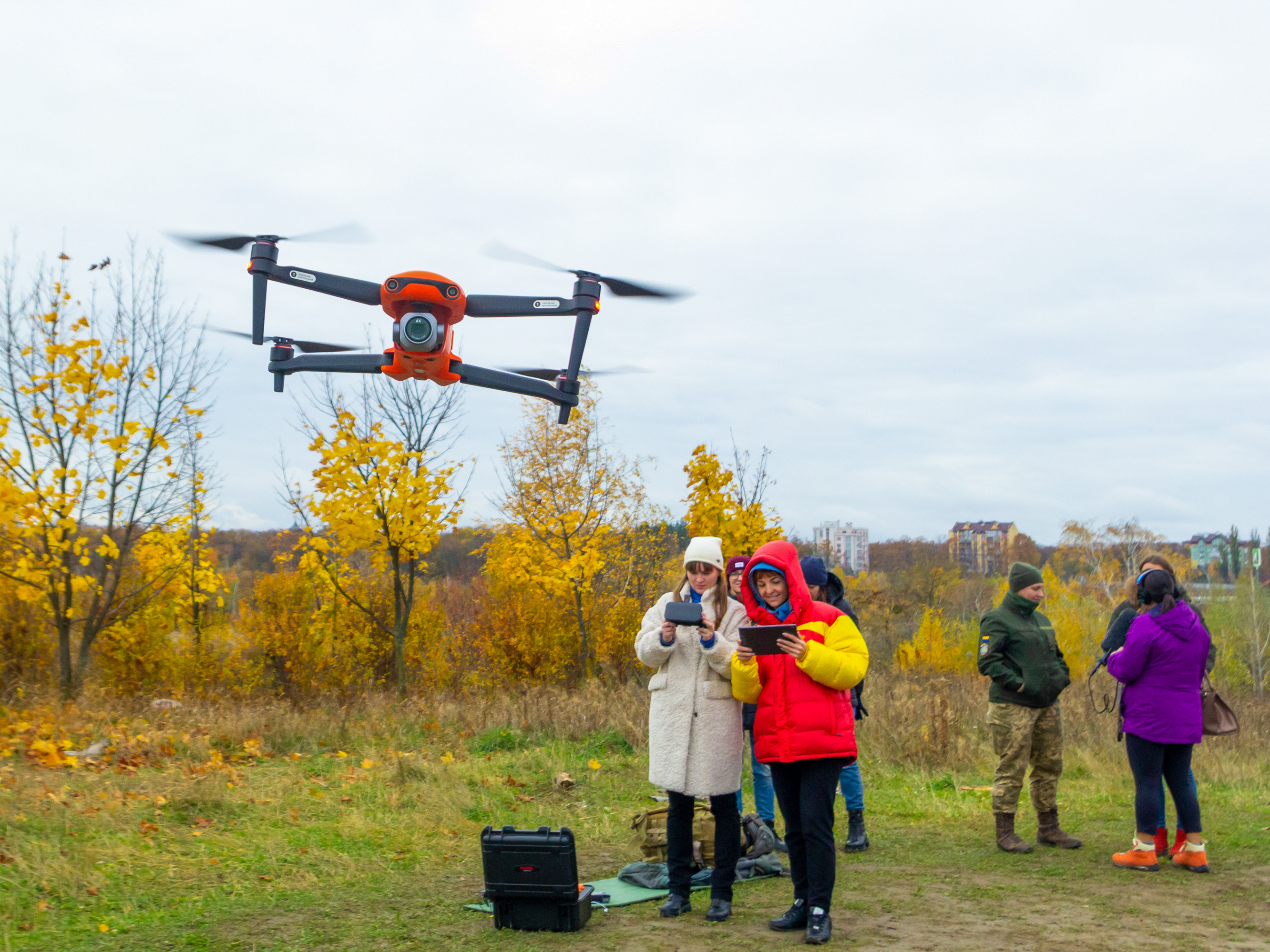 caption: Yevhenia Podvoiska and Tatiana Kuznetsova, from left, both policewomen, steer and navigate a drone during class in Kyiv on Oct. 27. Students must learn to work in pairs: a pilot and a navigator.