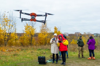 caption: Yevhenia Podvoiska and Tatiana Kuznetsova, from left, both policewomen, steer and navigate a drone during class in Kyiv on Oct. 27. Students must learn to work in pairs: a pilot and a navigator.