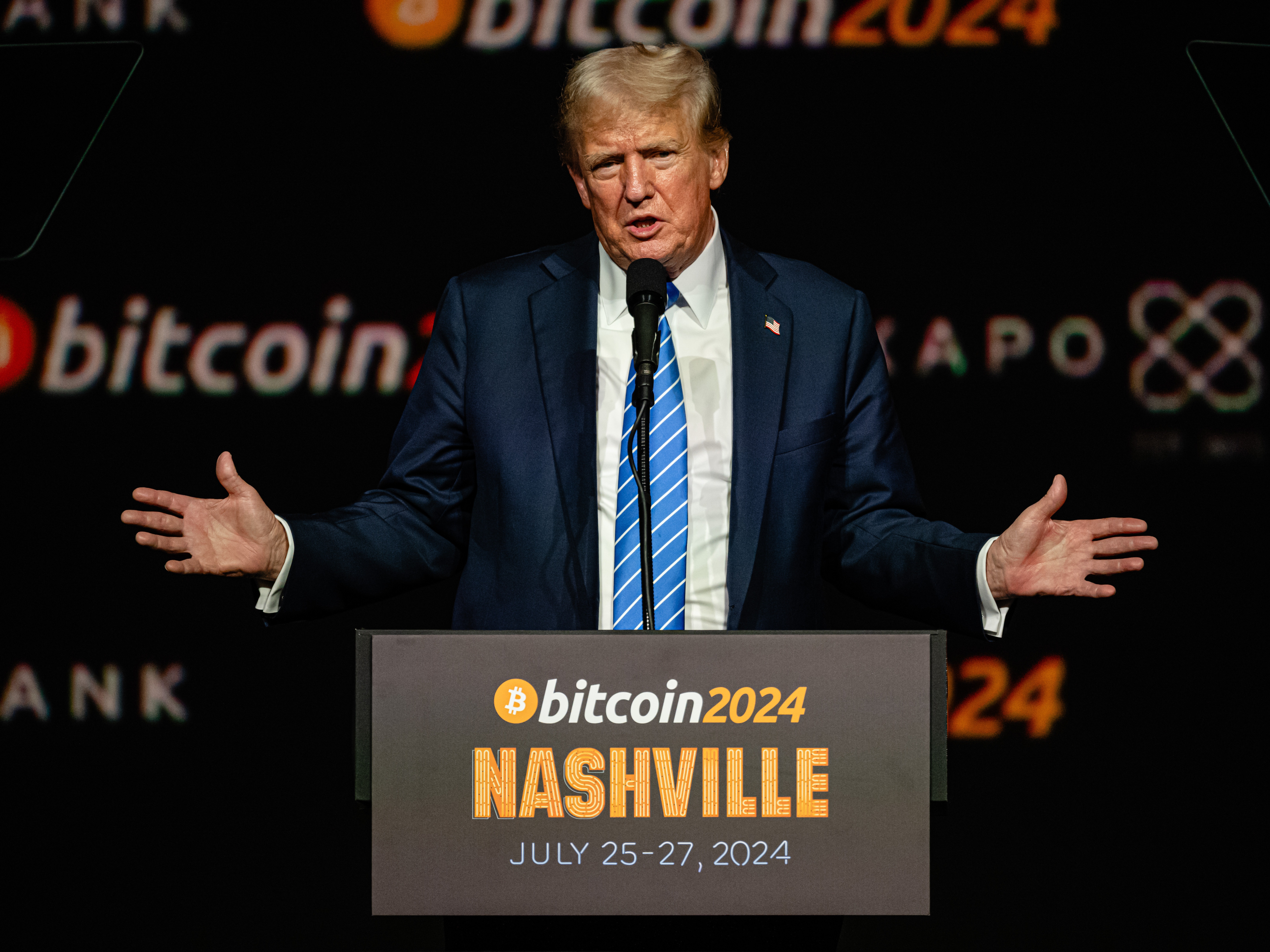 caption: President Trump addresses the Bitcoin 2024 conference at Music City Center in Nashville when he was still a candidate.