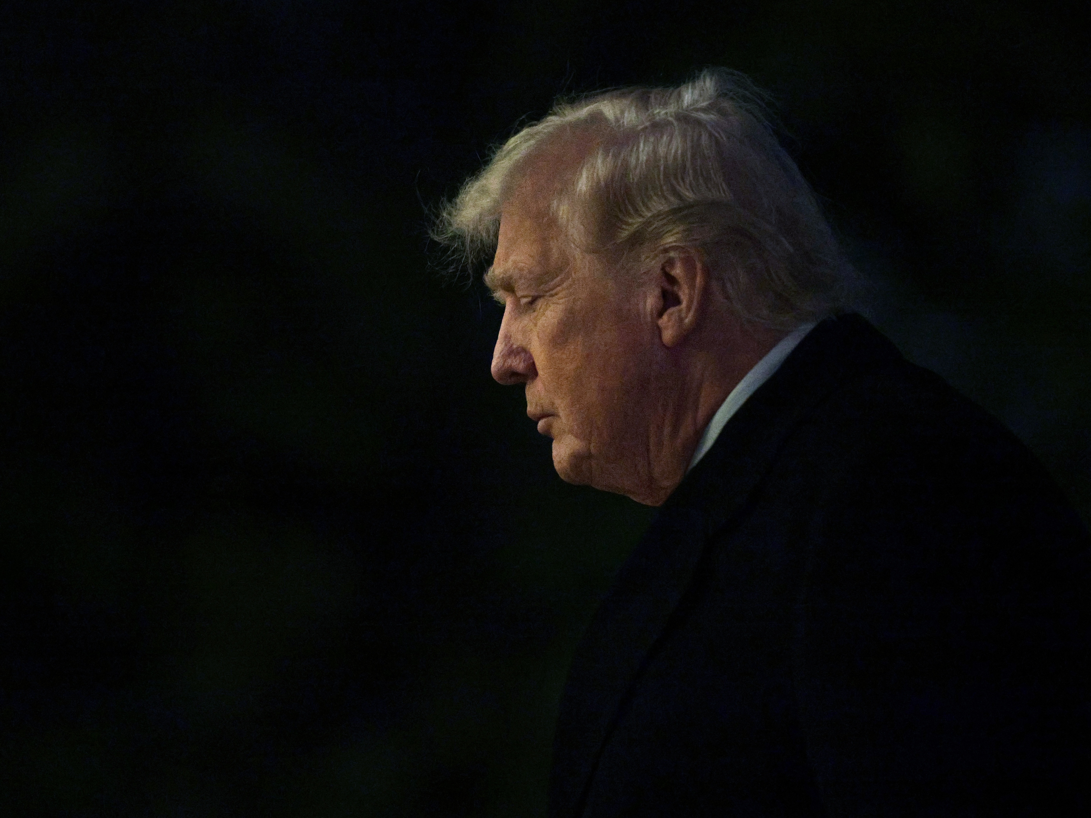caption: President Trump walks on the South Lawn after landing at the White House on Sunday. Trump returned to Washington from his winter break at the Mar-a-Lago Club in Palm Beach, Fla., one day after U.S. forces captured Venezuelan President Nicolás Maduro and his wife in a raid on his compound in Caracas.