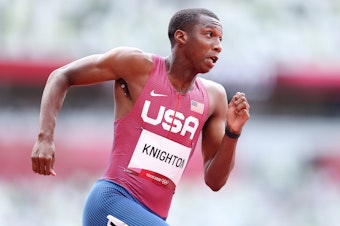 caption: U.S. sprinter Erriyon Knighton, shown here competing in a qualifying heat of the men's 200 meter at the Olympics, is racing in the final on Wednesday.