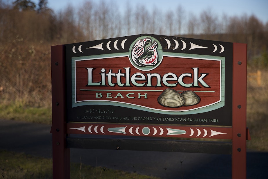 caption: A tribal-government sign for the renamed Littleneck Beach on Sequim Bay.