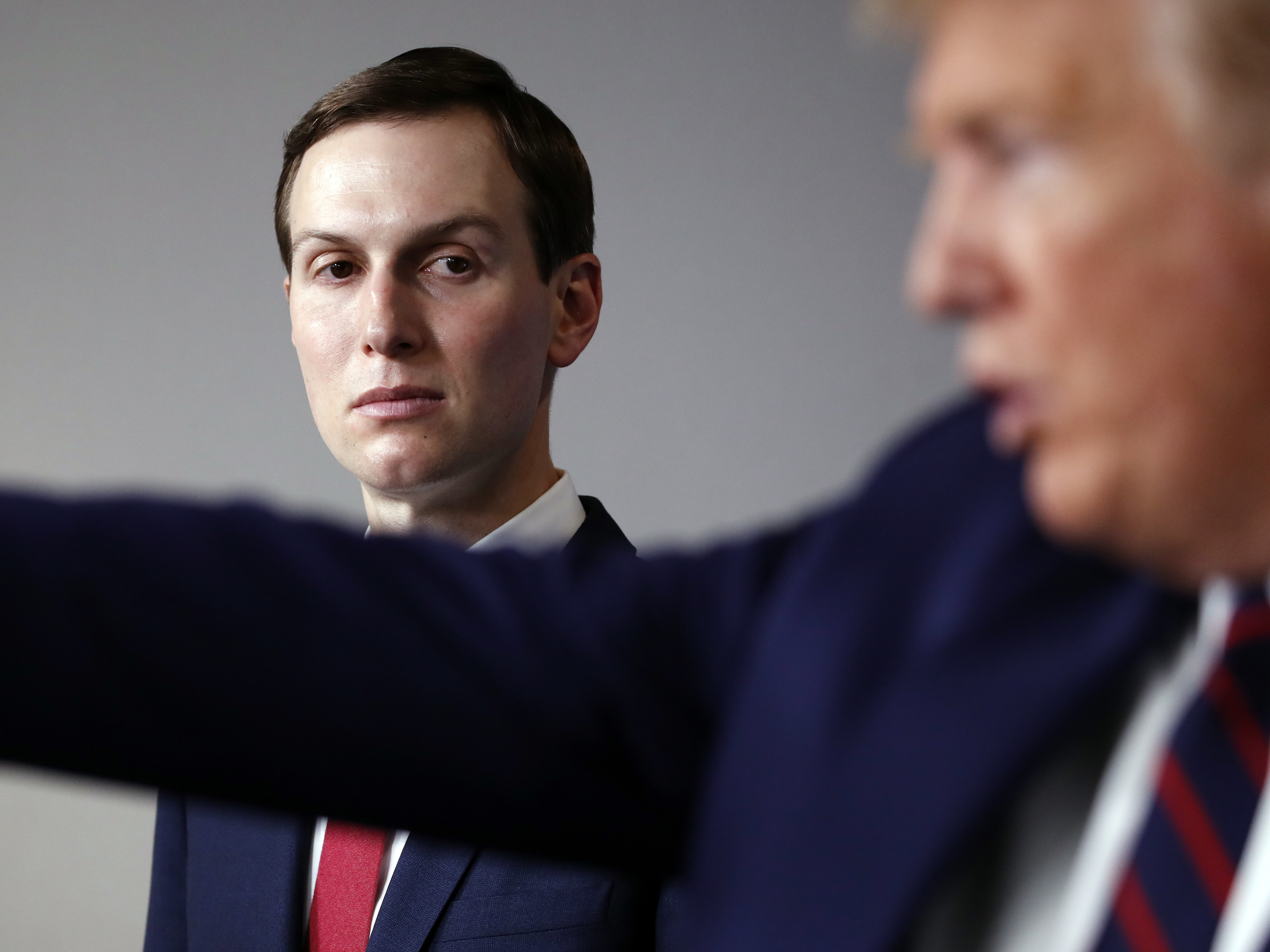 caption: White House adviser Jared Kushner listens as President Trump discusses the coronavirus.