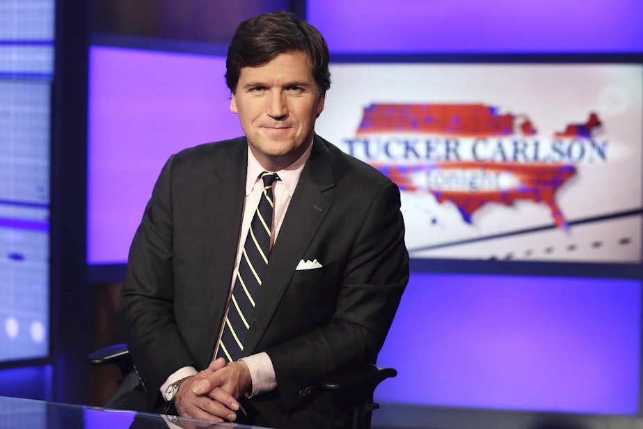 caption: Tucker Carlson, host of "Tucker Carlson Tonight," poses for photos in a Fox News Channel studio on March 2, 2017, in New York. 