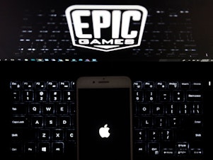 caption: Epic Games, creator of the popular game "Fortnite," accuses Apple of running its App Store as an illegal monopoly because it only allows in-app purchases on iPhones to be processed by Apple's own payment system. The trial outcome could have far-reaching consequences for Silicon Valley and the future of how money moves on smartphones and other devices.