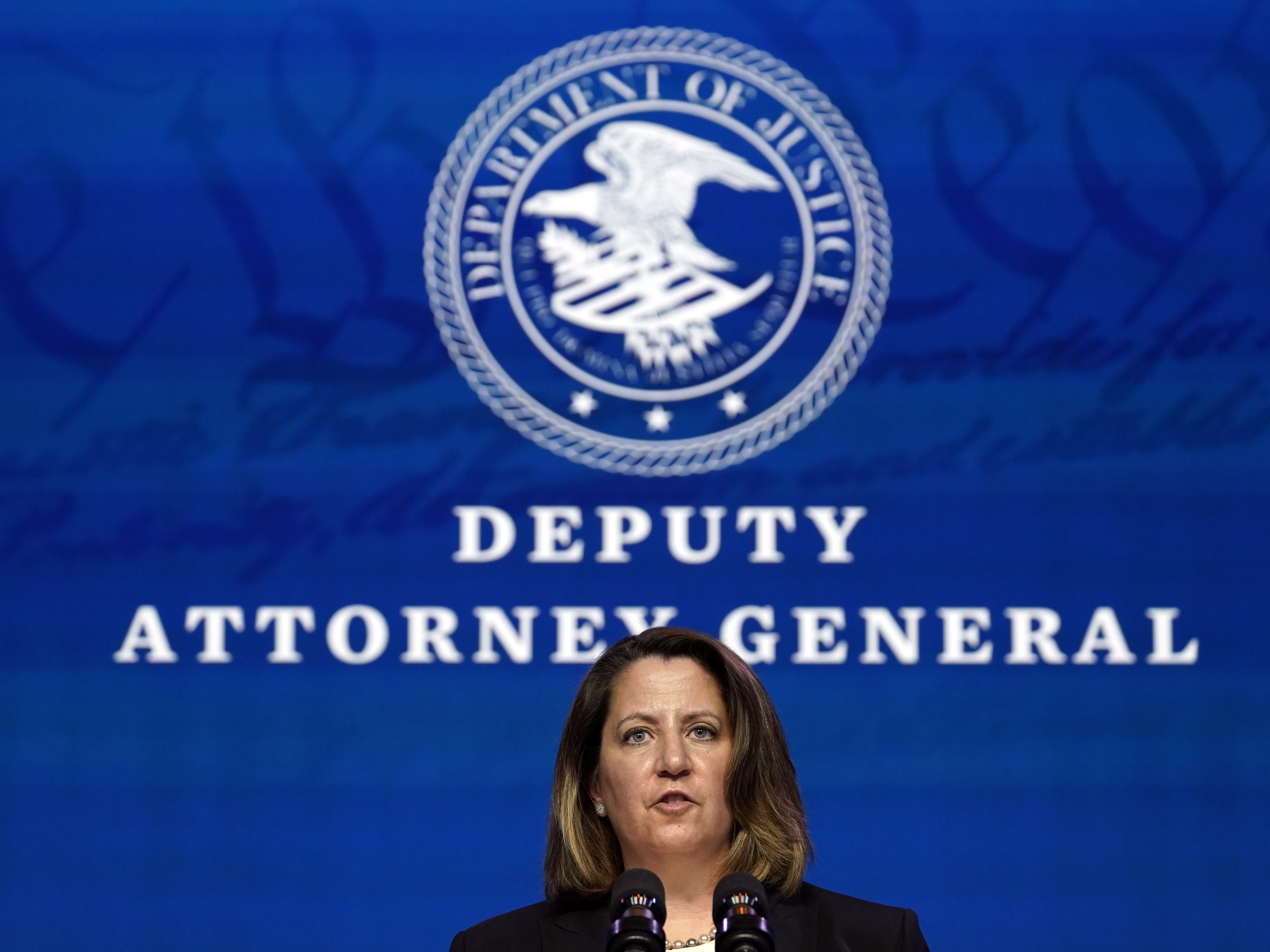 caption: Deputy Attorney General nominee Lisa Monaco speaks during an event with then-President-elect Joe Biden in Wilmington, Del., on Jan. 7. Her confirmation hearing is on Tuesday.
