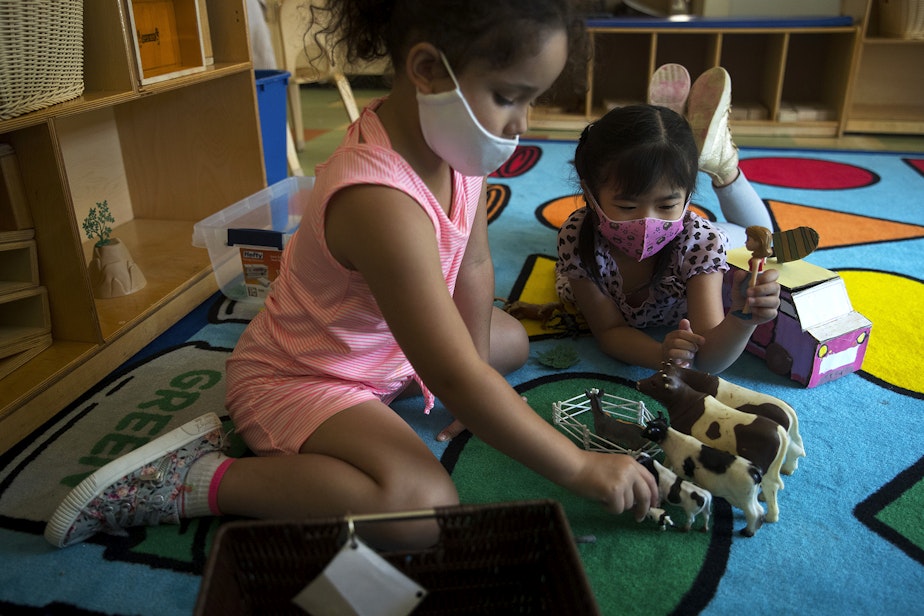 caption: Students in the kindergarten readiness summer program play together on Thursday, July 16, 2020, at the Denise Louie Education Center along Beacon Avenue South in Seattle.