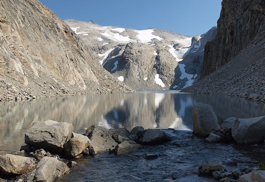 caption: Three small patches of Washington’s Hinman Glacier sit behind a newly formed lake in this 2009 photo along the crest of the Cascades.
