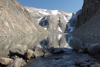 caption: Three small patches of Washington’s Hinman Glacier sit behind a newly formed lake in this 2009 photo along the crest of the Cascades.