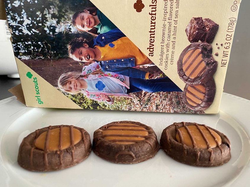 caption: The newest Girl Scout cookie, Adventurefuls, has fallen victim to supply chain and labor disruptions. The brownie-inspired treat features a caramel-flavored creme and a dash of sea salt.