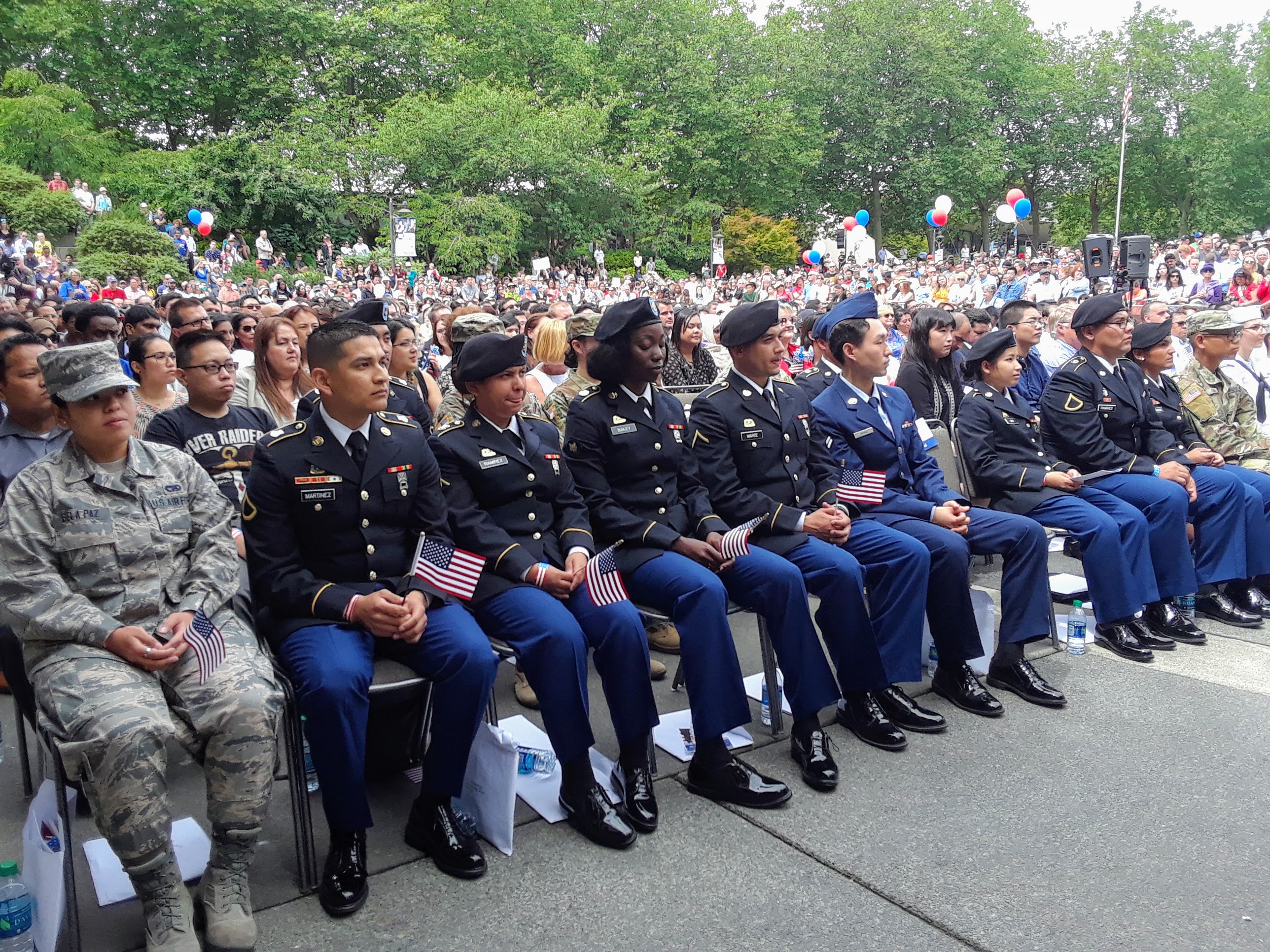 caption: 24 active service military members were sworn in as U.S. citizens