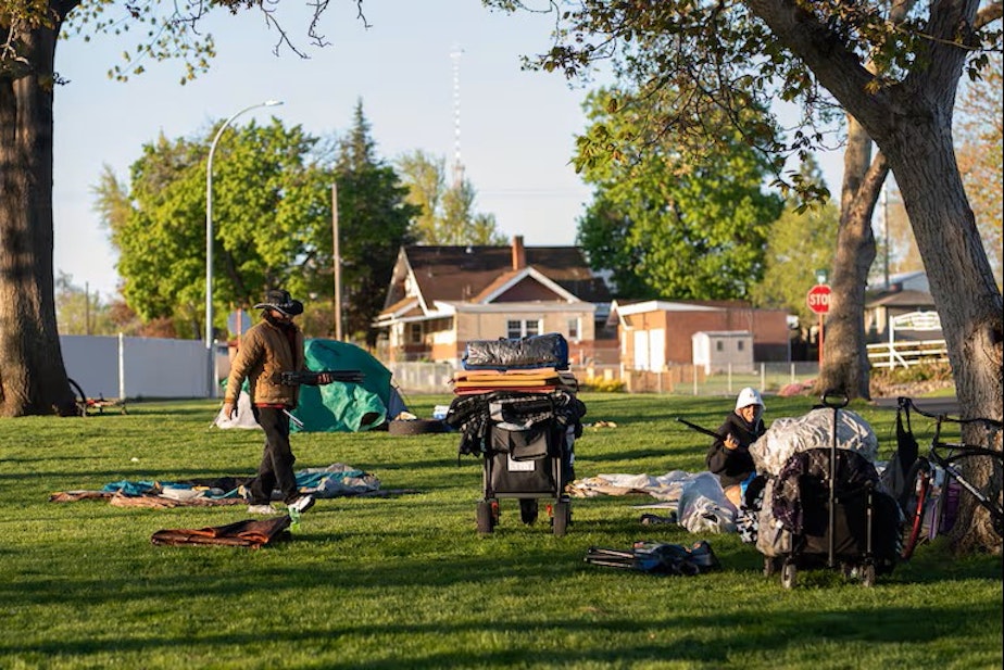 caption: John Parke and Tiffany Deen are among about 20 unhoused people who regularly sleep at Foster Park, the small space in the center of Clarkston that the city designated for camping.