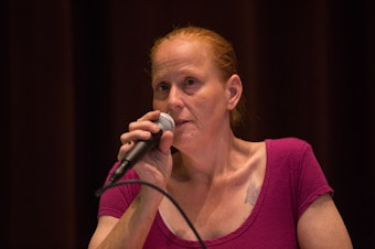 caption: Brandie Osborne, a resident of the Jungle, speaks at a KUOW event at Seattle Public Library about the city's plan to partner with the Union Gospel Mission to clear out the Jungle.