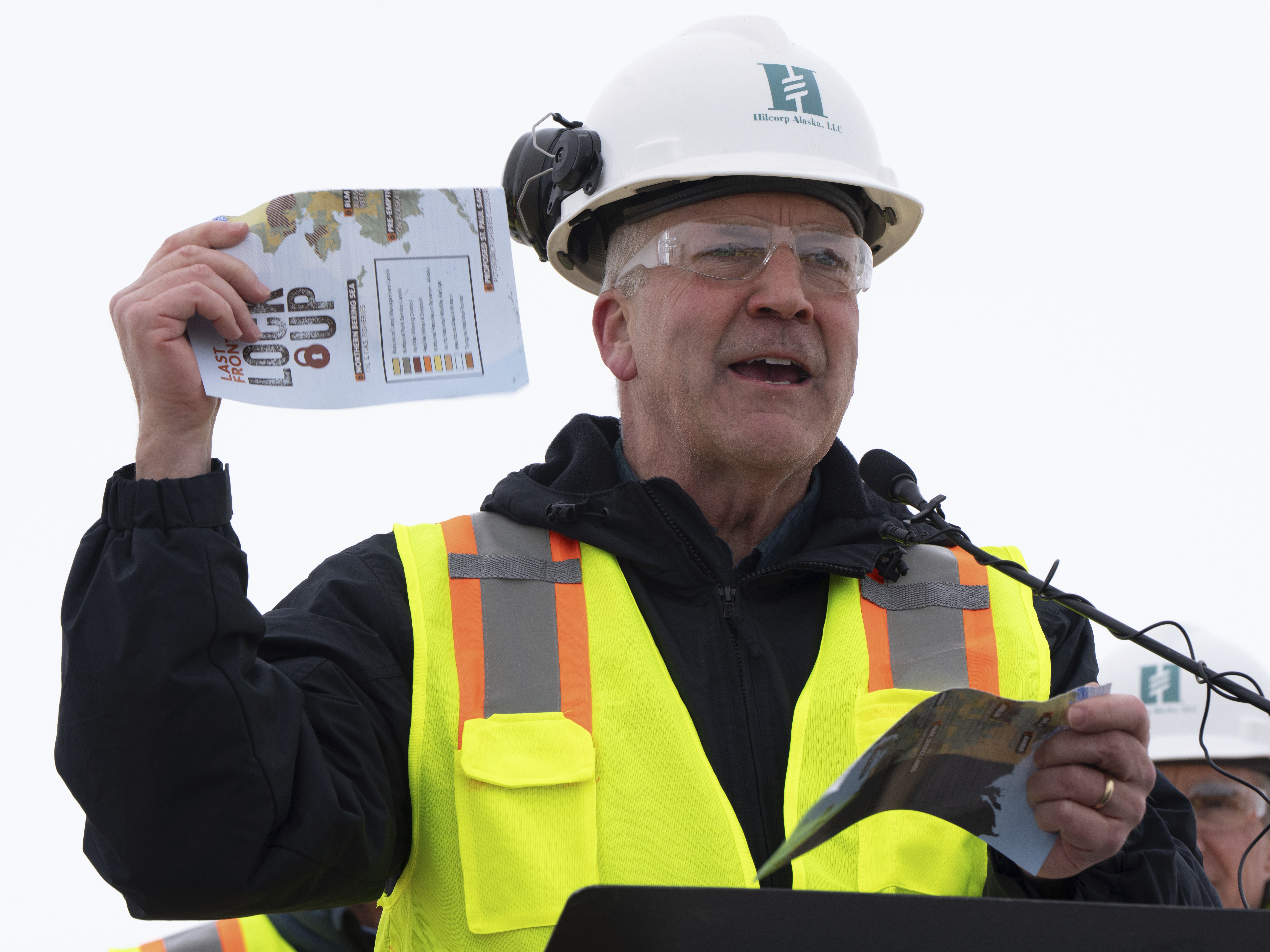 caption: Sen. Dan Sullivan, R-Alaska, rips up a piece of paper that had plans from the Biden administration during a news conference at the Pump Station 1 on Monday, June 2, 2025, located near Deadhorse, Alaska, on the state's prodigious North Slope.