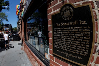 caption: A man walks past New York's Stonewall Inn, site of the 1969 uprising considered the birth of LGBTQ movement.