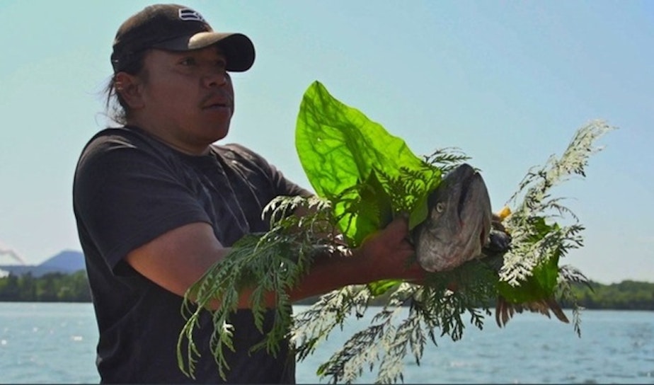 caption: A Native American takes part in a salmon ceremony. On Tuesday, the U.S. commerce secretary declared a fishery disaster for the Fraser River sockeye salmon fishery in Washington. That could lead to aid to nine tribes and non-tribal fishers.