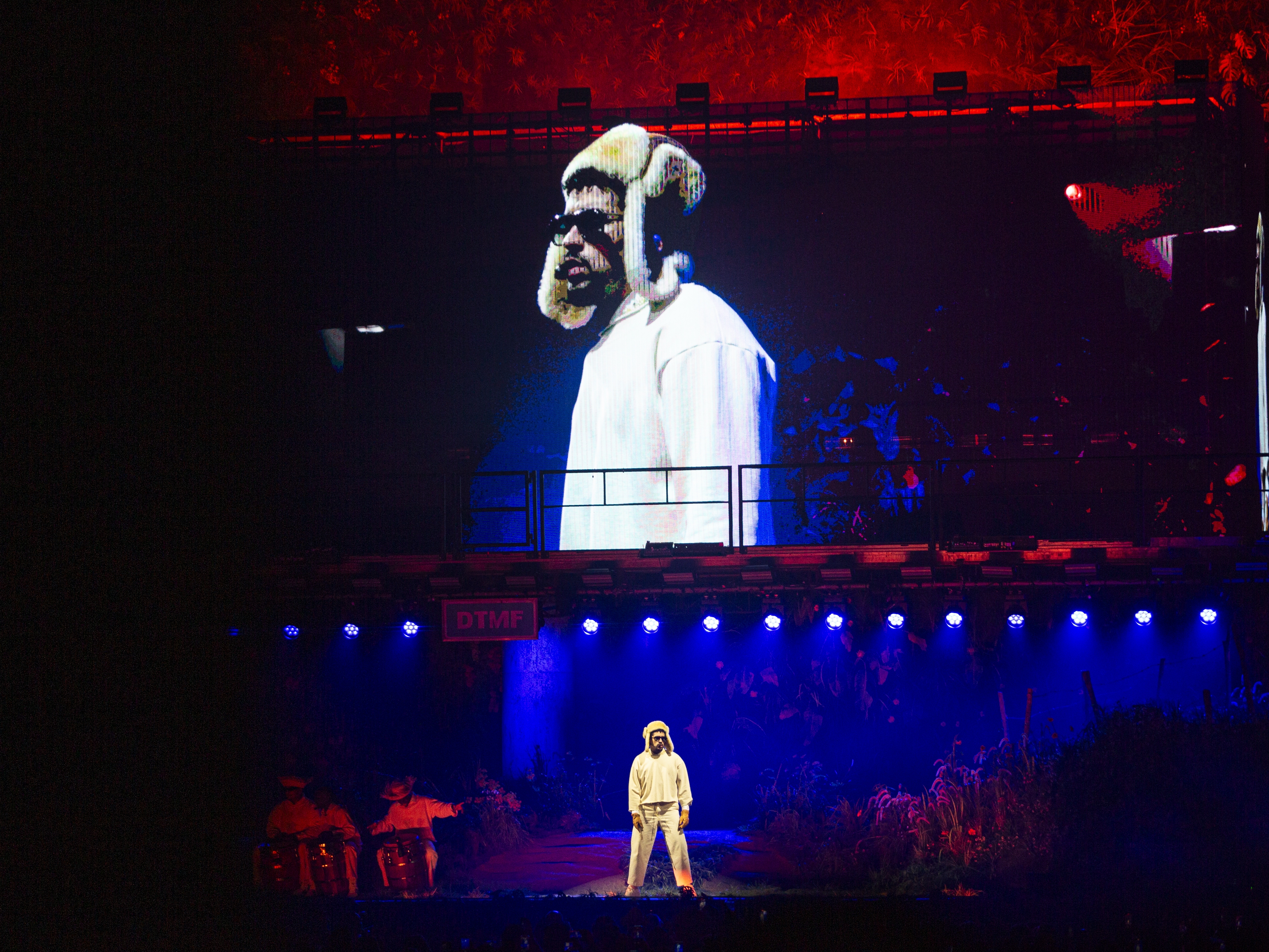 caption: Bad Bunny's concert, titled "No Me Quiero Ir De Aquí" ("I Don't Want To Leave Here"), is a love letter to Puerto Rico, and especially to the many thousands of Puerto Ricans who've been forced to leave their island in search of economic opportunity elsewhere, or are facing pressure to make that decision.
