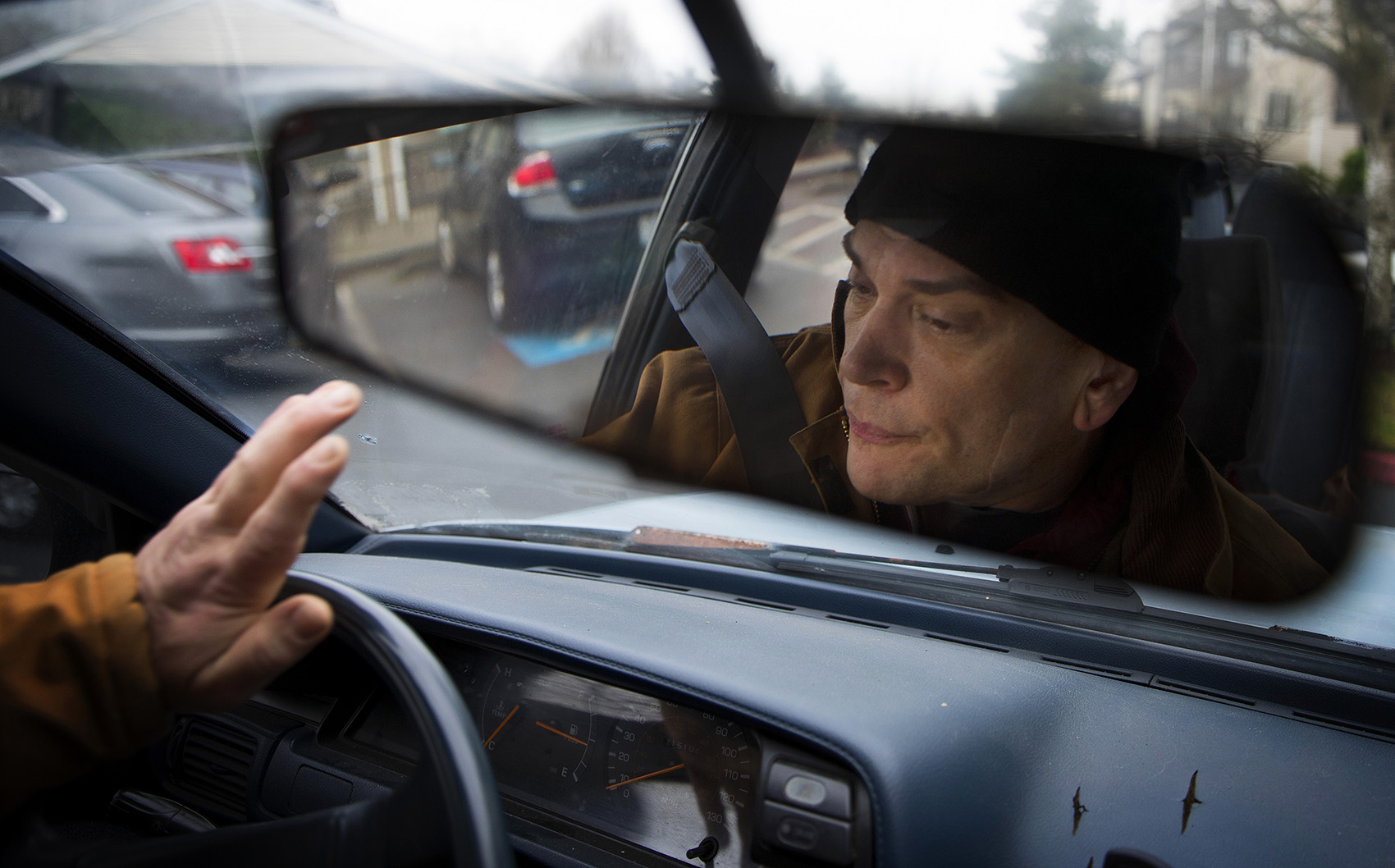 caption: Kevin Boggs drives to work at Vigor's Seattle shipyard on Friday, December 14, 2018, in Seattle.