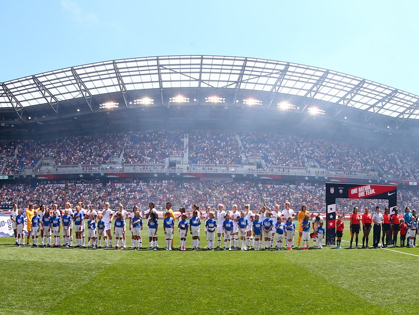caption: The U.S. women stand for the national anthem ahead of an international friendly with Mexico late last month before heading to France for the FIFA Women's World Cup, which kicks off today.