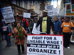 caption: The minimum wage debate has spurred demonstrations in cities beyond Seattle, like this one in New York.