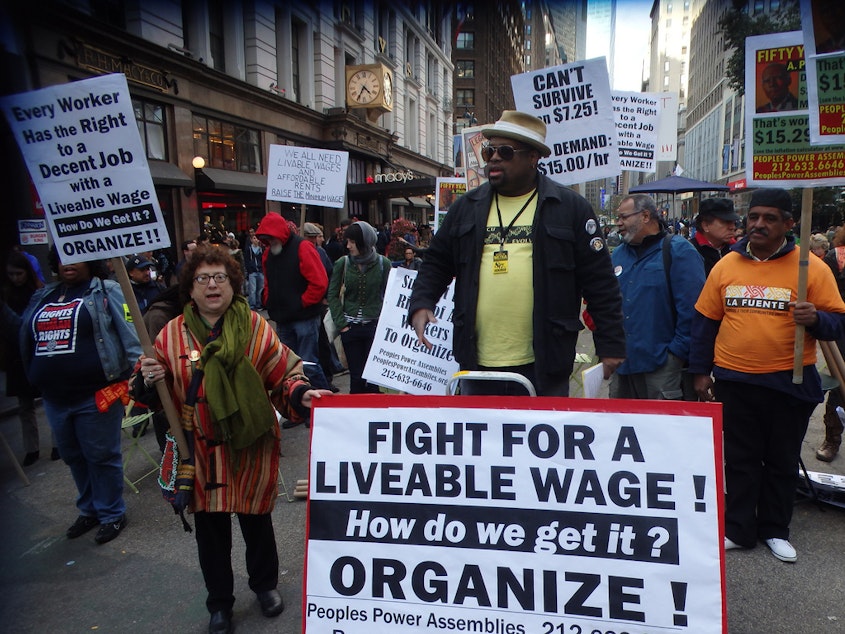 caption: The minimum wage debate has spurred demonstrations in cities beyond Seattle, like this one in New York.