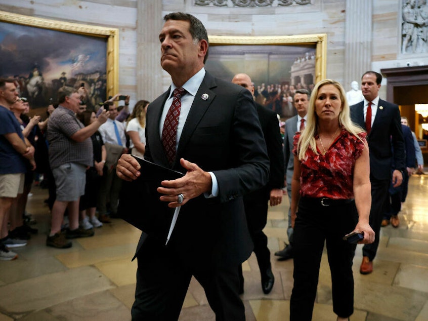 caption: House Homeland Security Committee Chairman Mark Green, R-Tenn., Rep. Marjorie Taylor Greene, R-Ga., and their fellow Republican impeachment managers walk back through the U.S. Capitol Rotunda after transmitting articles of impeachment against Homeland Security Secretary Alejandro Mayorkas to the Senate on Tuesday.