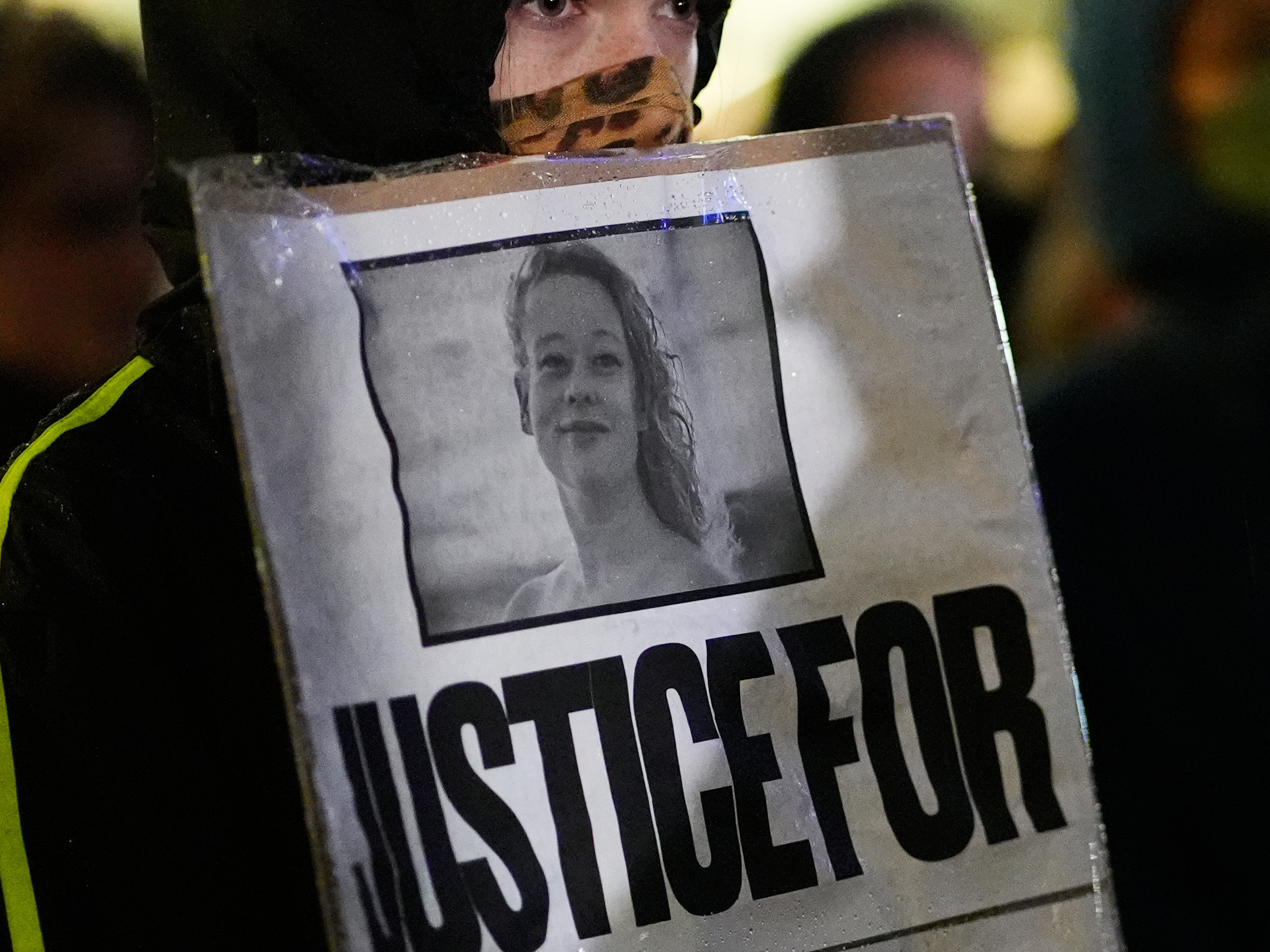 caption: Anna Donigan protests during a rally for Renee Good, who was fatally shot by an ICE officer in Minneapolis the day before, Thursday, Jan. 8, 2026, in Kansas City, Mo.
