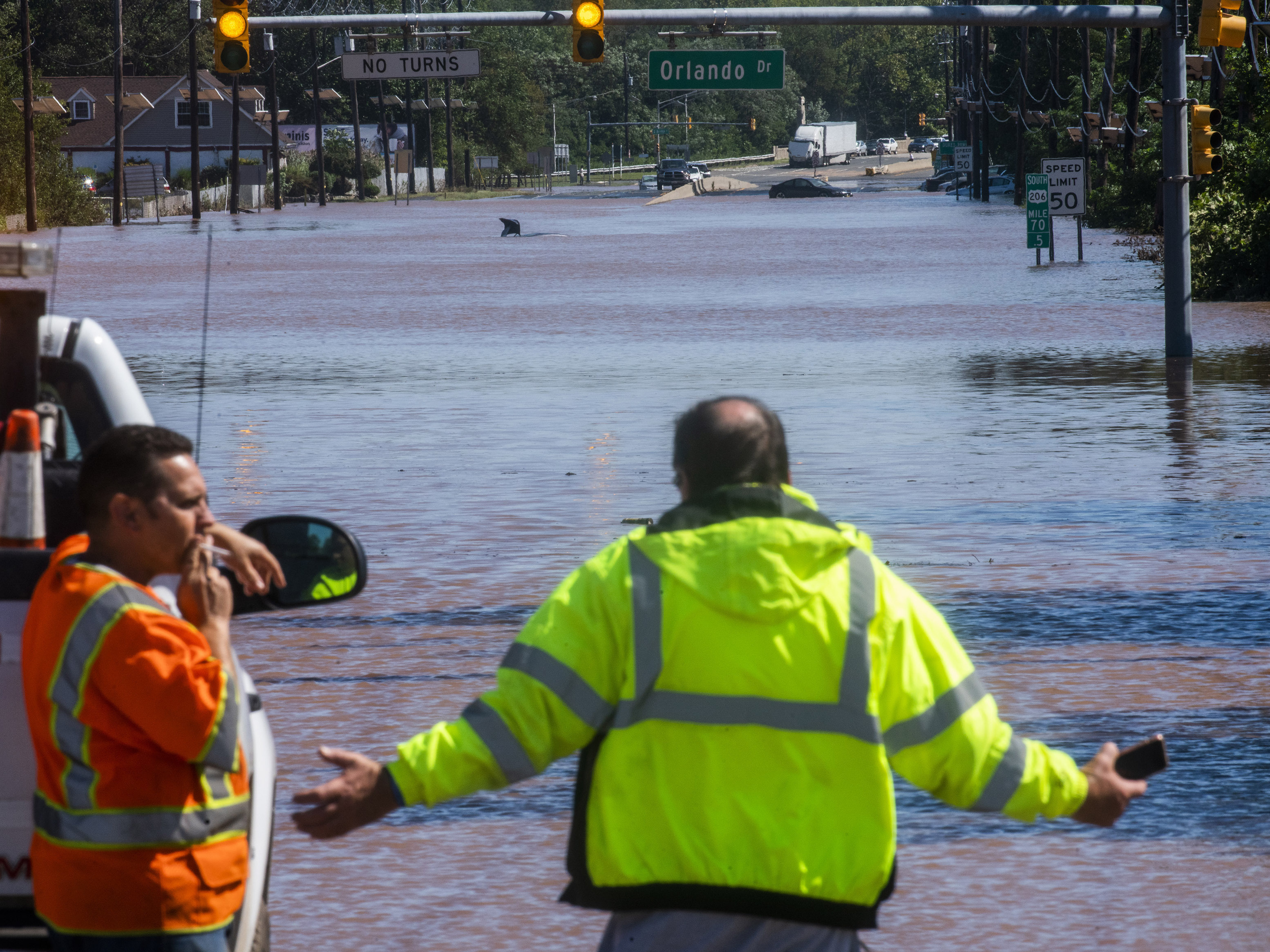caption: Route 206 in Somerville, N.J., remained largely under water on Thursday. Similar scenes played out across the state and its neighbors.