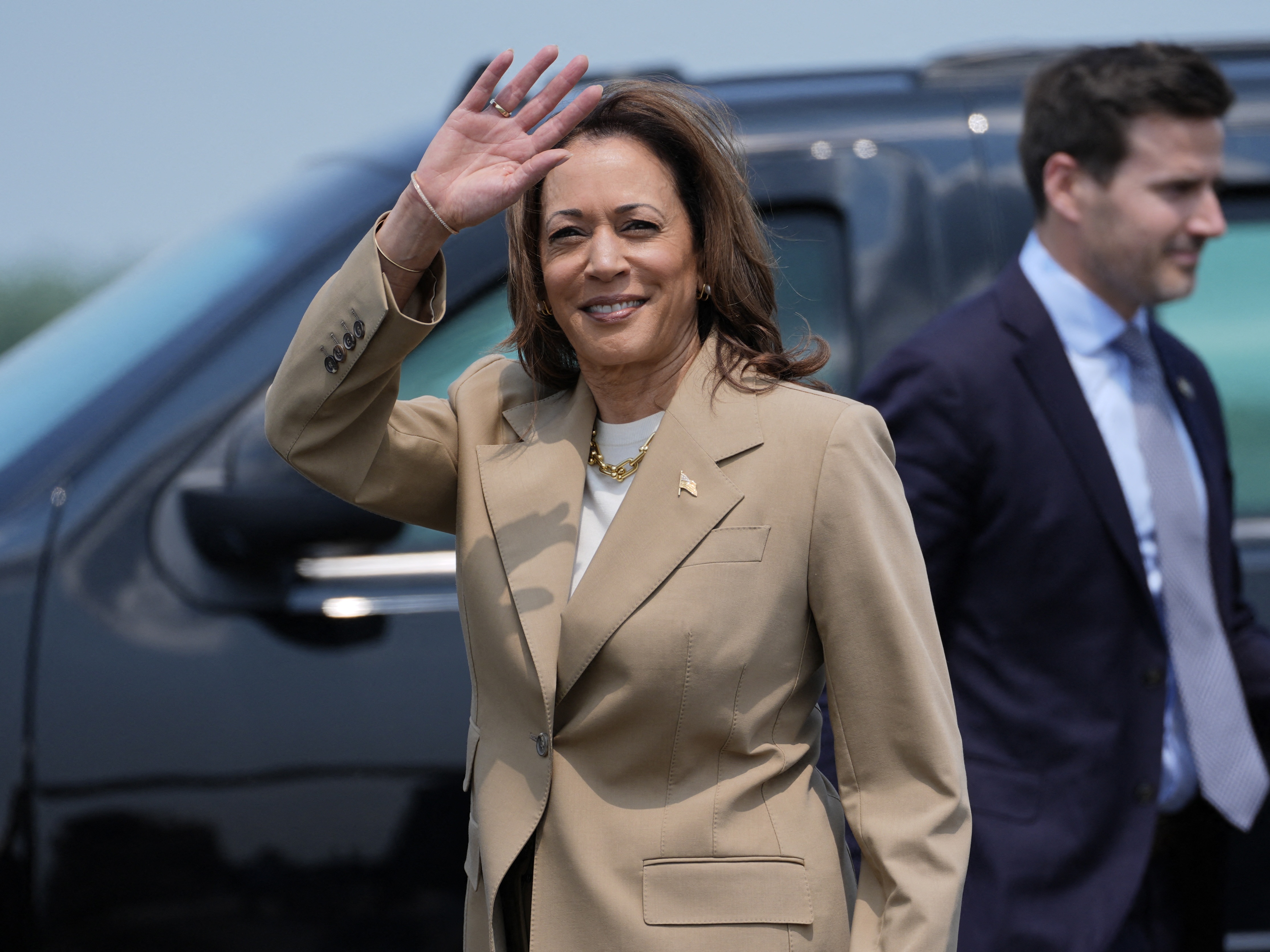 caption: Vice President and Democratic presidential candidate Kamala Harris arrives at Westfield-Barnes Regional Airport in Westfield, Massachusetts, on Saturday.
