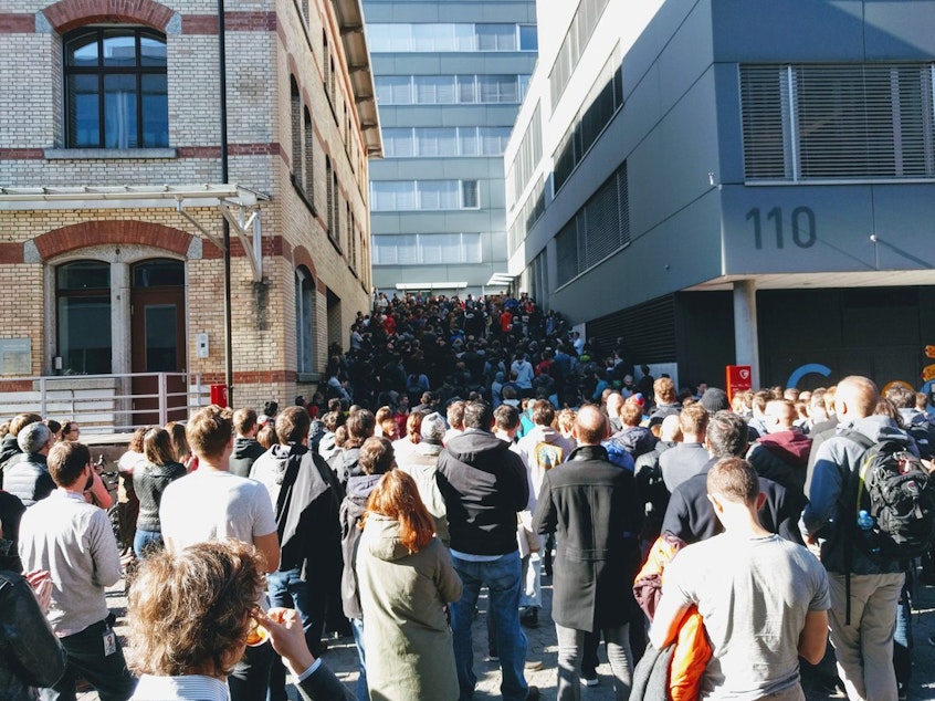 caption: People participate in a walkout at the Google office in Zurich on Thursday.