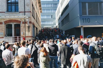 caption: People participate in a walkout at the Google office in Zurich on Thursday.