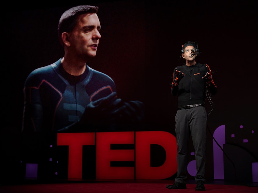caption: Doug Roble on the TED stage